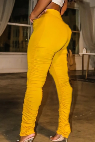 Pantaloni per altoparlanti a vita alta attillati con piega solida casual gialli